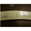 Image 6 : Ivory scrimshawed tusk on all four sides: walrus, polar bear face, seal, mukluk, mitten, seal, tool,