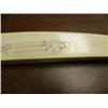 Image 7 : Ivory scrimshawed tusk on all four sides: walrus, polar bear face, seal, mukluk, mitten, seal, tool,