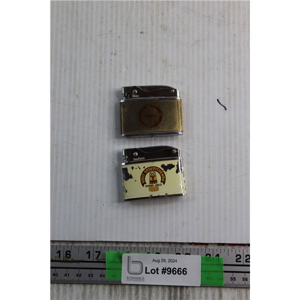 (2) Saskatchewan Diamond Jubilee Lighters - As Is