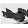 Image 2 : Four small Batmobiles tracing evolution of design)