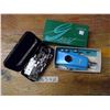 Image 1 : Automatic button holder and black sewing machine attachments tin
