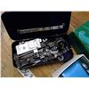 Image 2 : Automatic button holder and black sewing machine attachments tin