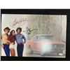 Image 1 : TOM WOPAT AND CATHERINE BACH SIGNED DUKES OF HAZZARD  11X17 PHOTO JSA COA