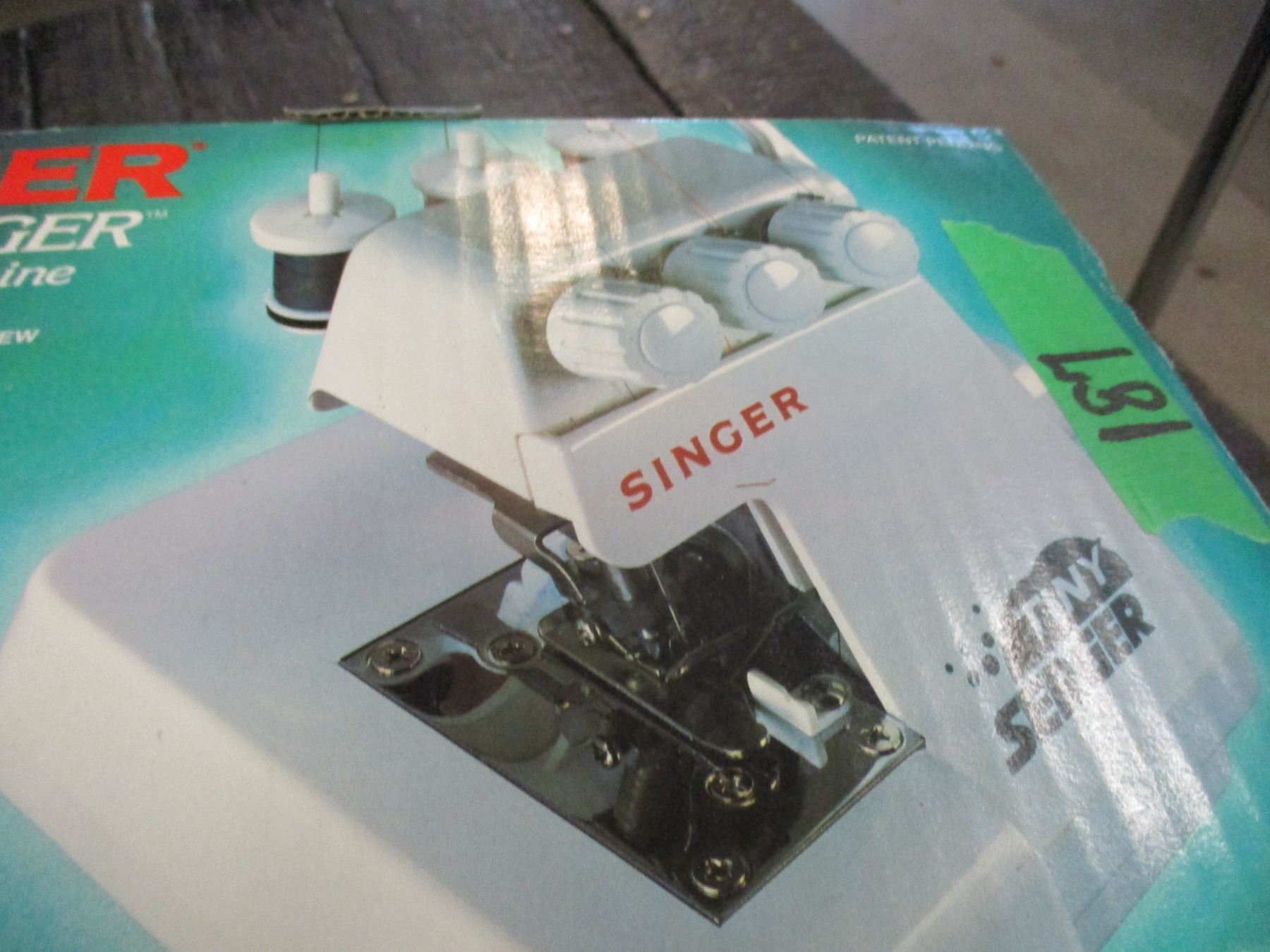 ESTATE: TINY SINGER SERGER IN ORIGINAL BOX