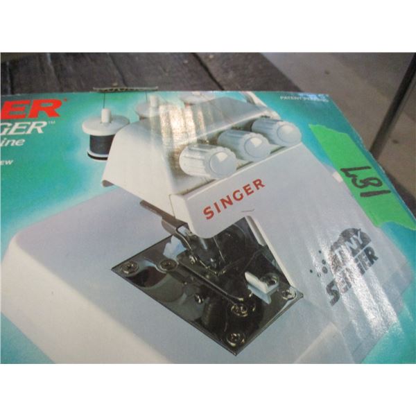 ESTATE:  TINY SINGER SERGER IN ORIGINAL BOX
