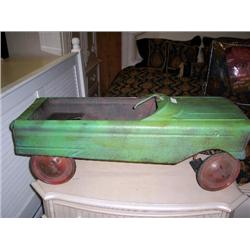 older green metal pedal car