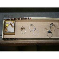 BOX WITH 2 DIAMOND RINGS AND OTHER RINGS