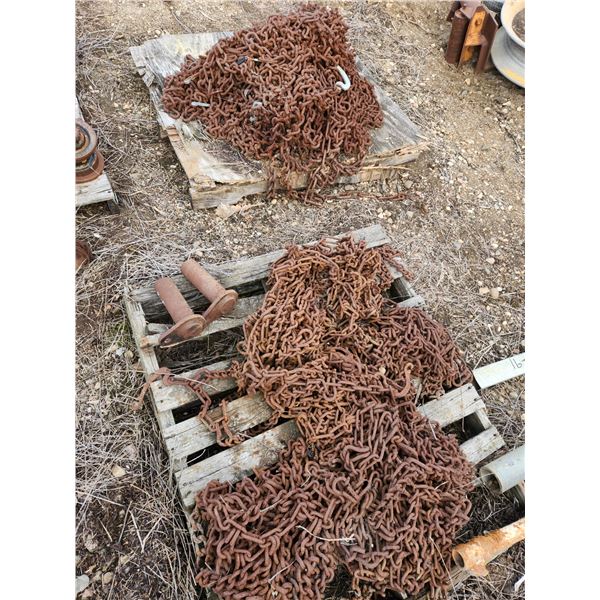 Tire chains (two pallets) and two misc pins. Wire rope in photo not included