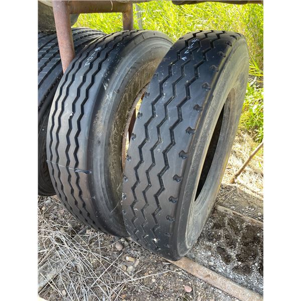 Two 11R24.5 Tires, one with a rim