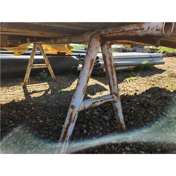 Two 8' long steel pipe racks and one piece of Aluminum tubing 6" diameter, 7ft long. Not to be loade