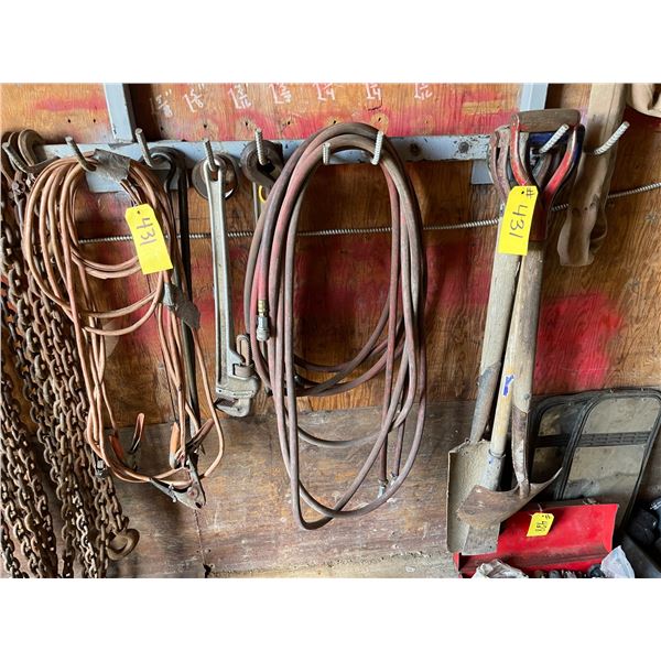 Misc hand tools, air hose and booster cables.