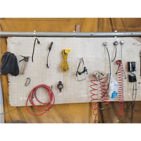 Peg board with air hoses, gauges and misc tools