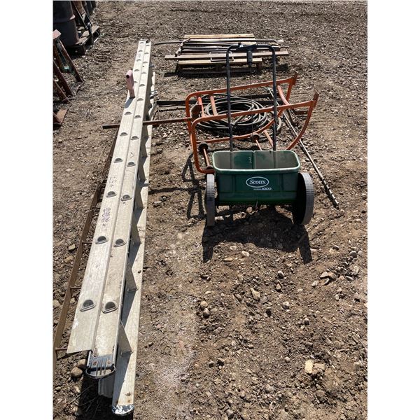 Ladder, Fertilizer/Seed spreader, hose, strapping, oil barrel dolly and long steel piece of racking