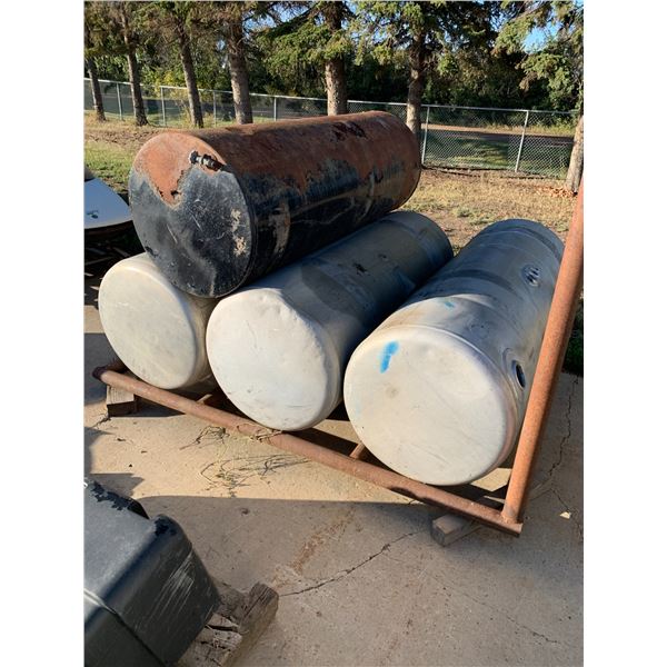Four fuel tanks c/w steel frame. Ph Rick (780) 531-2779, From Hwy 825 East on Boysdale Rd & South 1 