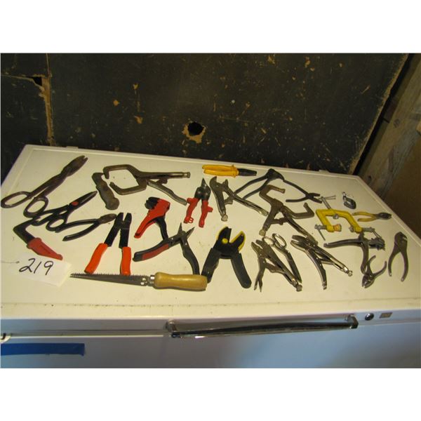 Assorted pliers , welding clamps, vice grips, scissors and tin snips