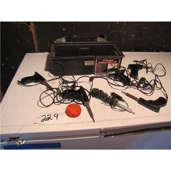 Assortment of soldering guns in plastic toolbox