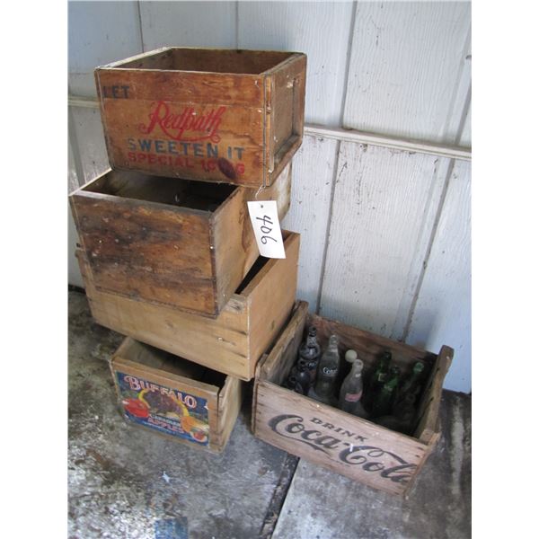 vintage wood boxes and collector coke and other bottles