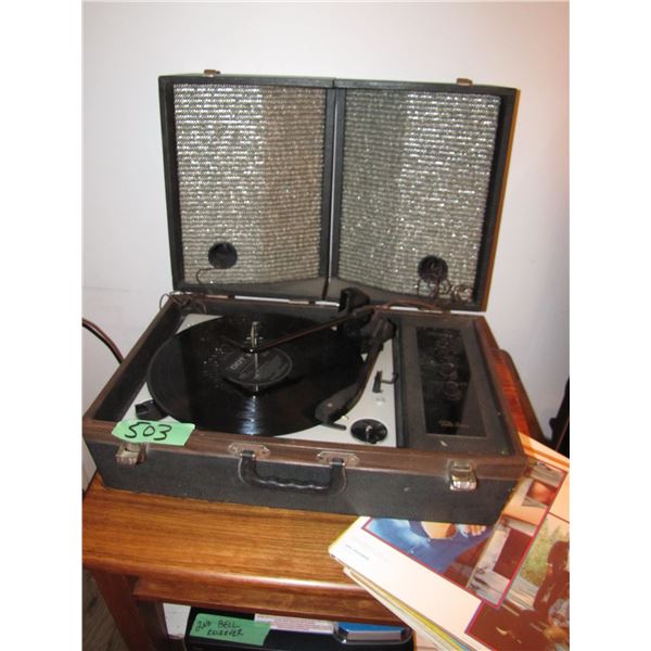 Record player with records and student desk it is sitting on