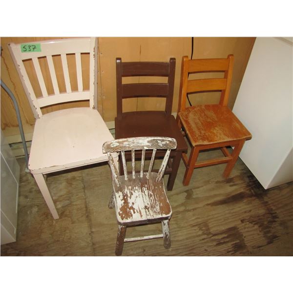 One larger wood chair and three smaller children's chairs