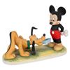 Image 1 : A Porcelain Mickey Feeding Pluto Figurine.