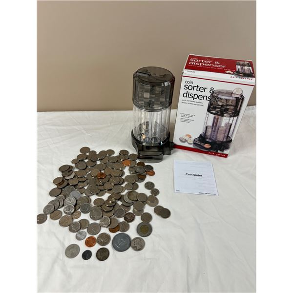 Assortment of international currency and coin sorter