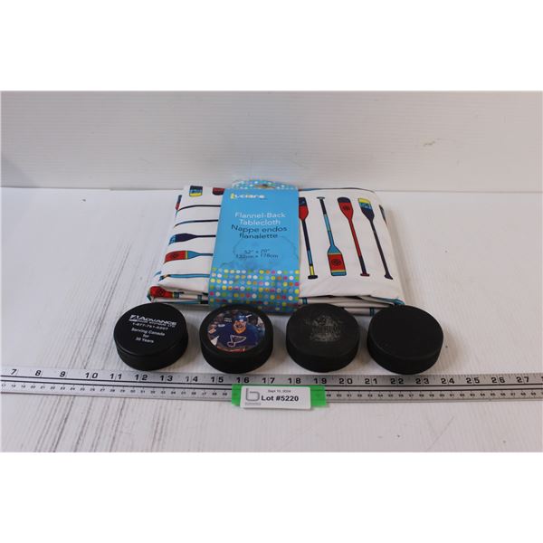 Flannel-Back Tablecloth - Appears New & (4) Hockey Pucks (One is Foam)