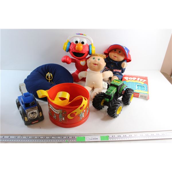 Elmo Toy, Neck Pillow, John Deere Tractor Toy, Cabbage Patch Doll, Pop It and Assorted Toys