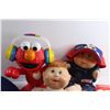 Image 6 : Elmo Toy, Neck Pillow, John Deere Tractor Toy, Cabbage Patch Doll, Pop It and Assorted Toys