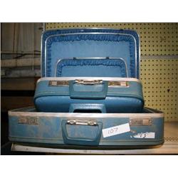 3 BLUE SUITCASES