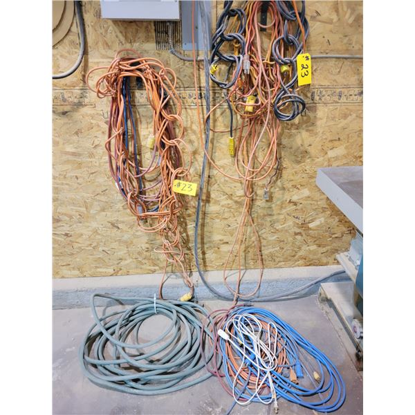 various extension cords and garden hose