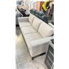 Image 2 : BEIGE FABRIC 3 SEAT COUCH WITH WOODEN ACCENTS (83"W 33.5"D 29.5"H)