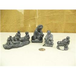 Lot of 4 castings: boy with fish, women with seal, 2 sled dog teams and  man with sled (229)