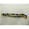 Image 1 : Multi-gemstone bracelet, 14K yellow gold, Peridot, amethyst, garnet, blue topaz, oval faceted, appro