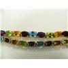 Image 2 : Multi-gemstone bracelet, 14K yellow gold, Peridot, amethyst, garnet, blue topaz, oval faceted, appro