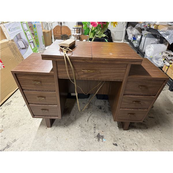 Singer, touching so sewing machine in cabinet with accessories