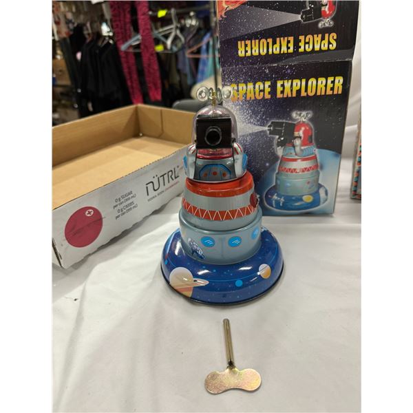 Space explorer tin toy with key