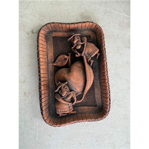 Signed terra-cotta wall art