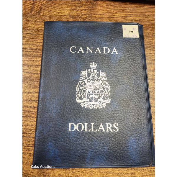 Blue Folder with 24 1983 Canada Dollar Coins