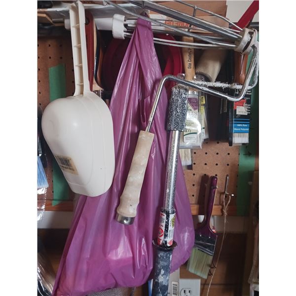 Painting Supplies on Pegs in Photo