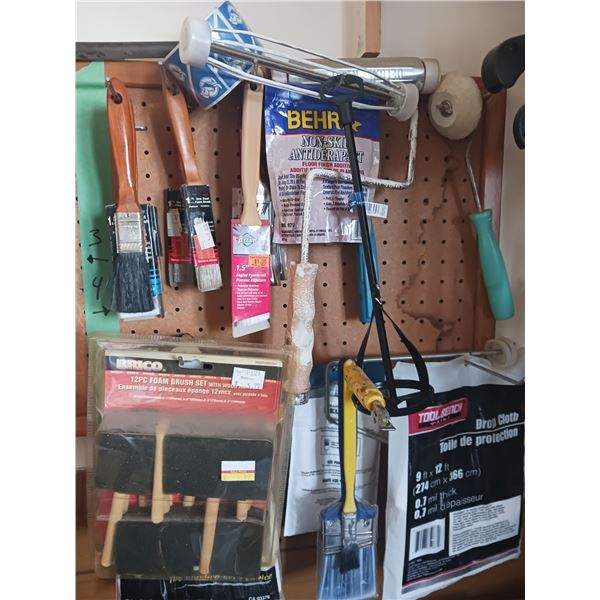 Painting Supplies on Pegs in Photo