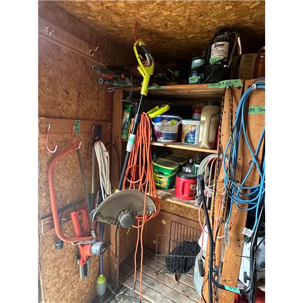 Ryobi Trimmer + Items Hanging On Wall to the Left of it