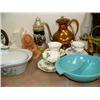 Image 4 : Whole shelf of: milk glass, Alaska stein, bookends, collector's teapots, brass, copper wear, blue de