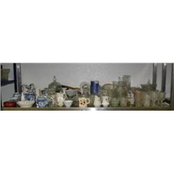 Middle shelf of blue and white dishes, teapots, clock, milk glass, tea set pressed glass, etc. (227)