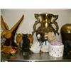 Image 4 : Top shelf consisting of: figures, shells, brass pots, cat, clock, huge brass duck, carved wood eagle