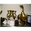 Image 5 : Top shelf consisting of: figures, shells, brass pots, cat, clock, huge brass duck, carved wood eagle
