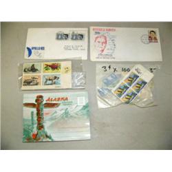 Lot of stamps and Alaska souvenirs folder (2)
