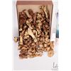 Image 2 : Box of small carving bones and a Inukshuk building kit
