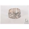 Image 2 : Sterling silver Haida cuff bracelet decorated in thunderbird and sun symbols, marked MAG (Metal Arts