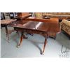 Image 1 : Antique Regency style mahogany drop leaf library table with two drawers, brass capped feet and casto
