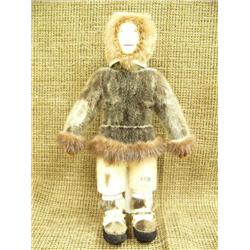 Man doll with hand sewn leather face, seal skin parka, pants and mukluks - very nice doll, signed He
